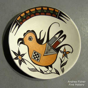 Parrot, floral and geometric design on a polychrome plate