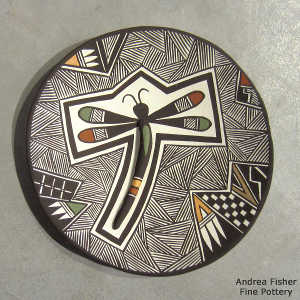 Dragonfly, fine line and geometric design on a polychrome plate