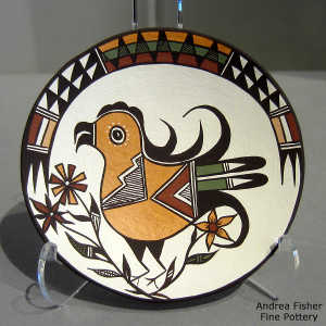 Parrot, flower and geometric design on a polychrome plate