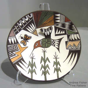 Butterfly, hummingbird, corn plant and geometric design on a polychrome plate