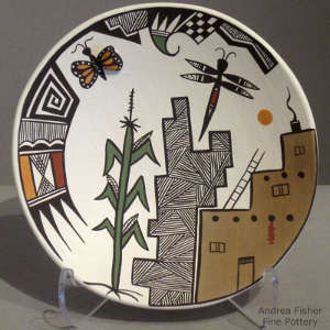 Publo, corn, dragonfly, butterfly and geometric design on a polychrome plate