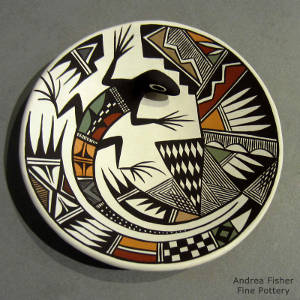 Lizard, shard, rain and geometric design on a polychrome plate