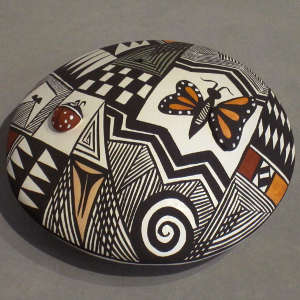 Lady bug, butterfly and shard design on a polychrome seedpot