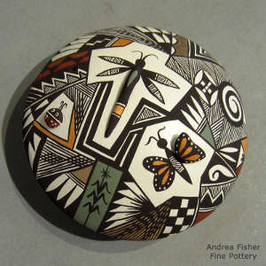 Fine line, insect, shard and geometric design on a polychrome seed pot