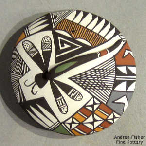 Lizard, shard and geometric design on a polychrome seed pot