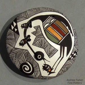 Fine line, fish, cloudeater and geometric design on a polychrome seed pot