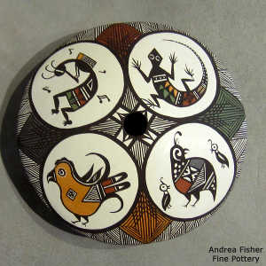 Medallion, fine line and geometric design on a polychrome seed pot