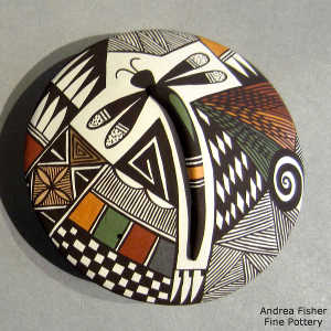 Dragonfly, shard, spiral and geometric design on a polychrome seed pot