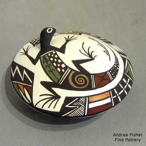 Lizard and geometric design on a polychrome seed pot