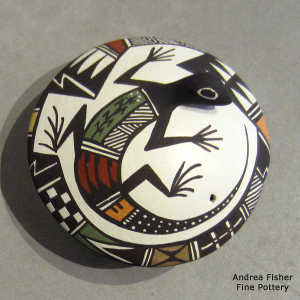 Lizard and geometric design on a polychrome seed pot