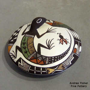 Lizard, lady bug and geometric design on a polychrome seed pot