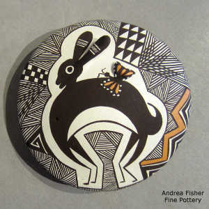 Mimbres rabbit, butterfly and geometric design on a polychrome seed pot