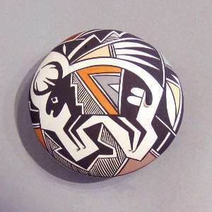 Elk and geometric design on a polychrome seed pot