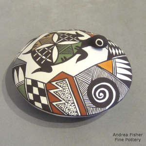Turtle, shard and geometric design on a polychrome seed pot