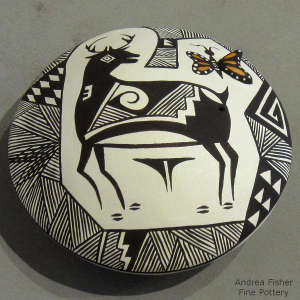 Deer, butterfly and geometric design on a polychrome seedpot