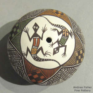 Fine line, Mimbres lizard and geometric design on a polychrome seed pot
