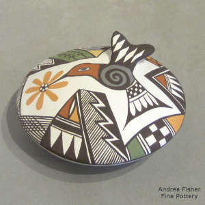 Hummingbird, flower, shard and geometric design on a polychrome seedpot