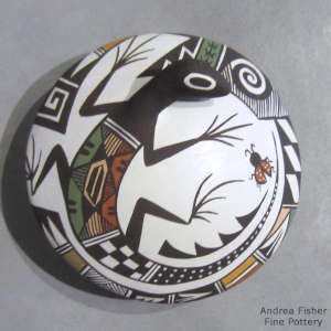Shard, lizard, ladybug and geometric design on a polychrome seed pot