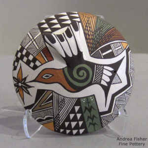 Hummingbird, flower and geometric design on a polychrome seedpot