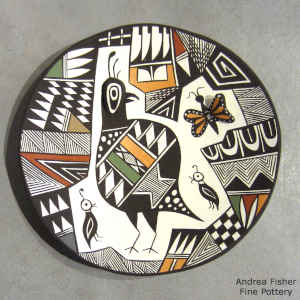 Quail, butterfly and geometric design on a polychrome seed pot