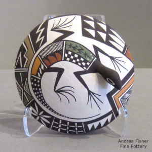 Lizard and geometric design on a polychrome seed pot