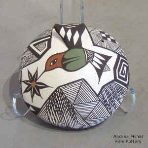 Hummingbird, flower and geometric design on a polychrome seed pot