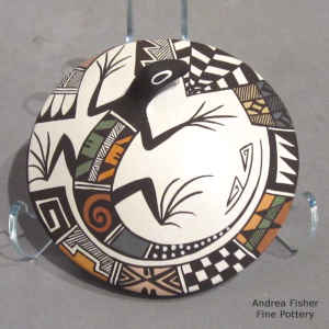 Lizard and geometric design on a polychrome seed pot