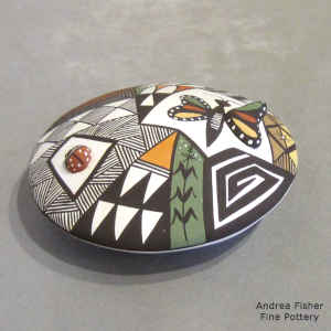 Lady bug, butterfly, fine line and geometric design on a polychrome seed pot
