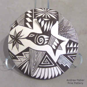 Hummingbird, flower and geometric design on a black and white seed pot