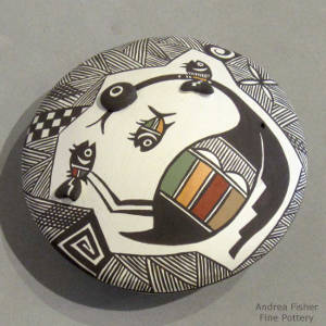 Polychrome seedpot with Mimbres bird and fish design