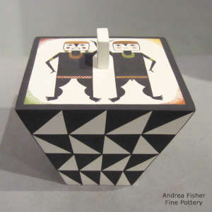 Geometric design on the sides of a lidded polychrome box with Mimbres couple on top