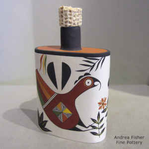 Bird, flower and geometric design on a polychrome canteen