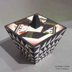 Faces and geometric design on top and geometric design on the sides of a polychrome lidded pyramid piece
