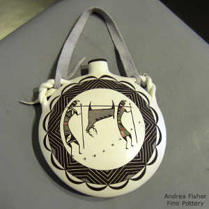 Deer, hunters and geometric design on a polychrome canteen