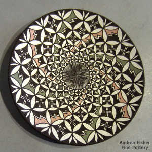 Fine line and swirl geometric design on a polychrome plate