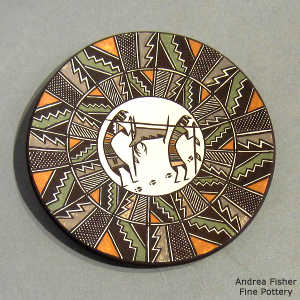Hunters, deer and geometric design on a polychrome plate