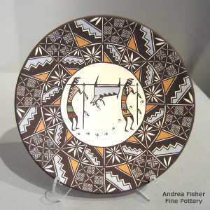 Hunters, deer and geometric design on a polychrome plate