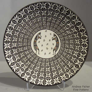 Kokopelli and geometric design on a polychrome plate