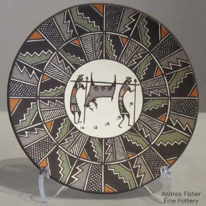 Hunters, deer and geometric design on a polychrome plate