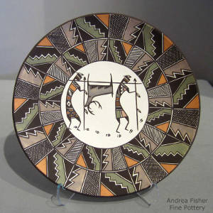 Hunters, deer and shard geometric design on a polychrome plate