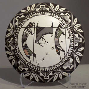 Hunters, deer and geometric design on a polychrome seedpot