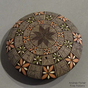 Fine line and geometric design on a polychrome seedpot