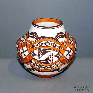 Medallion, rainbow and geometric design on a polychrome jar