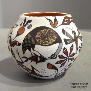 Cloudeater, fish, animal and geometric design on a polychrome jar