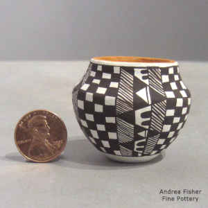 Checkerboard and geometric design on a miniature polychrome jar