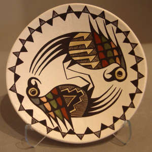 Parrot and geometric design on a small polychrome plate