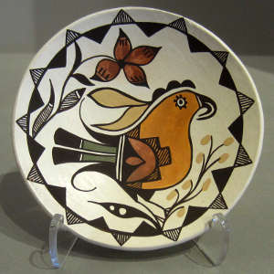 Parrot, floral and geometric design on a polychrome plate