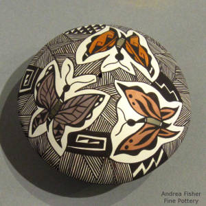 Mimbres butterflies, fine line and geometric designs on a polychrome seedpot