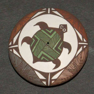 Fine line, turtle and geometric designs on a polychrome seedpot