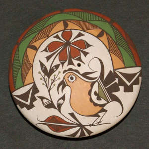 Flower, parrot and geometric design on a polychrome seedpot